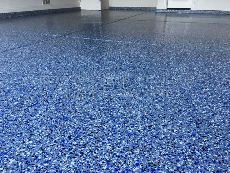 Completed epoxy garage floor coating project Katy Texas showing decorative flakes