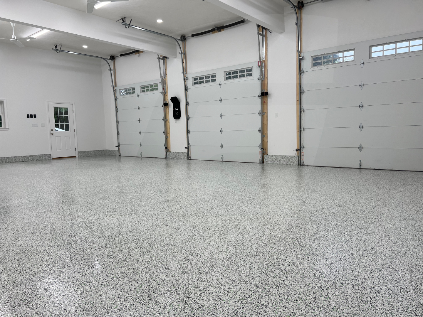 Premium polyaspartic garage floor coating Houston with high-gloss finish